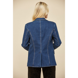 Back view of a classic blue denim blazer styled in modern western chic fashion