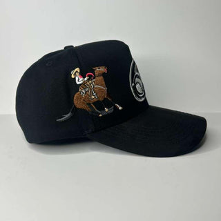 Black cap with embroidered design on a white background