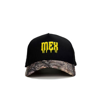 Black and camouflage cap with yellow 'mek' logo on a white background