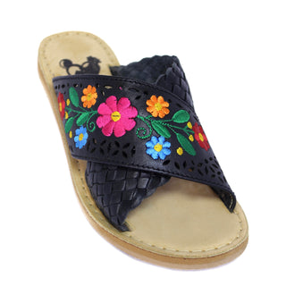Black leather crossed sandals with colorful floral embroidery