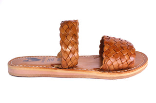 Side view of a leather woven double strap slide on sandal in the color honey